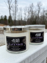 Load image into Gallery viewer, Two white candles with the label &quot;Elf Leaf Farm Lavender Candle&quot; are positioned close to the camera. 
